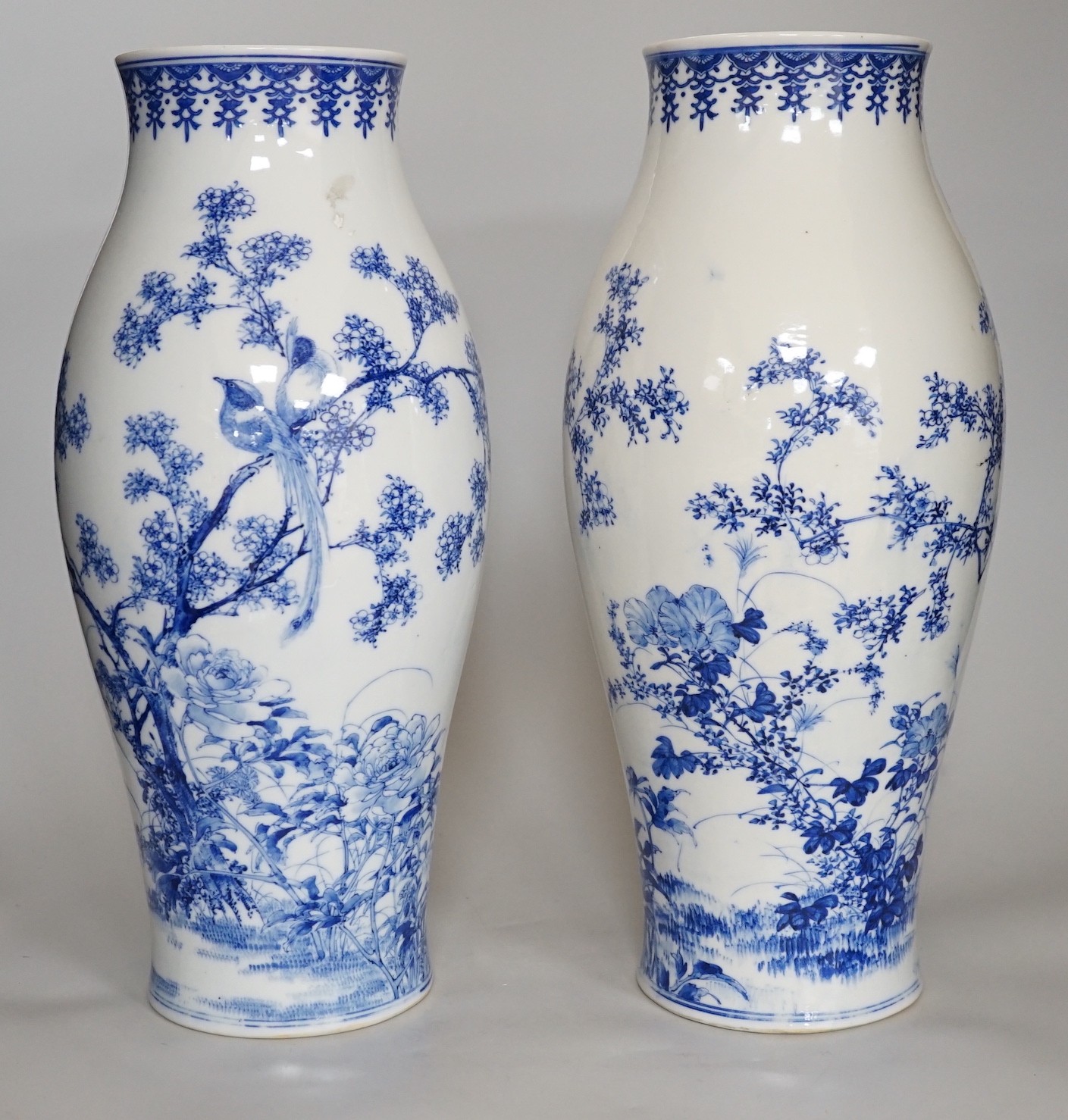 A pair of Japanese blue and white vases, 37cm high